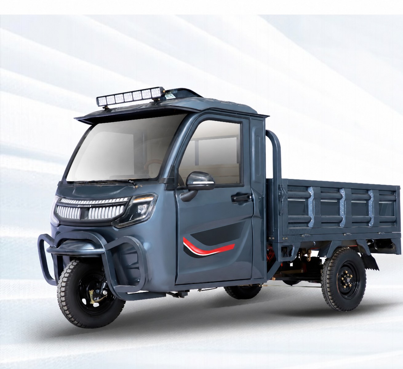 Dark blue electric cargo tricycle with an enclosed driver's cab and open cargo bed